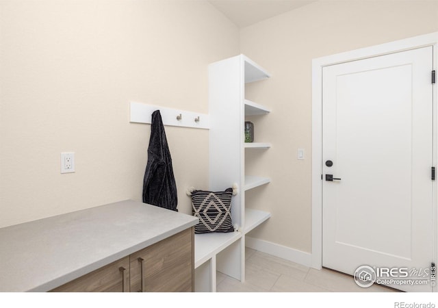 mudroom featuring light tile patterned flooring