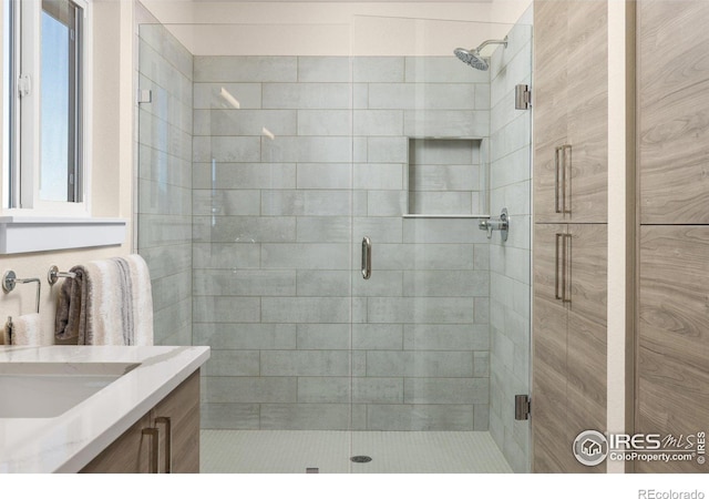 bathroom with vanity and walk in shower