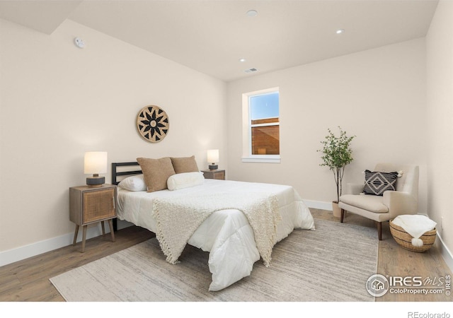 bedroom featuring hardwood / wood-style floors