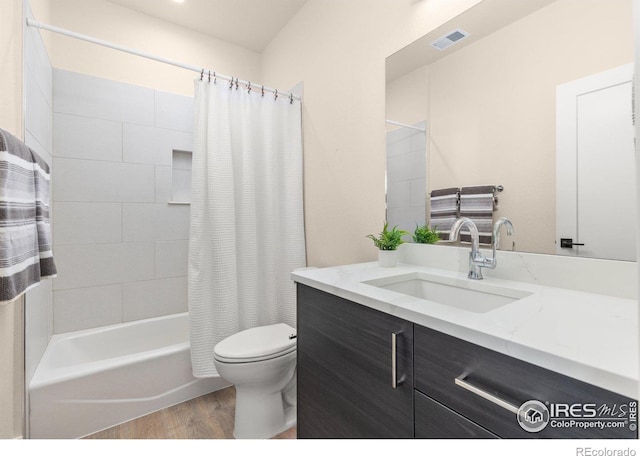 full bathroom featuring shower / bath combo, toilet, wood-type flooring, and vanity