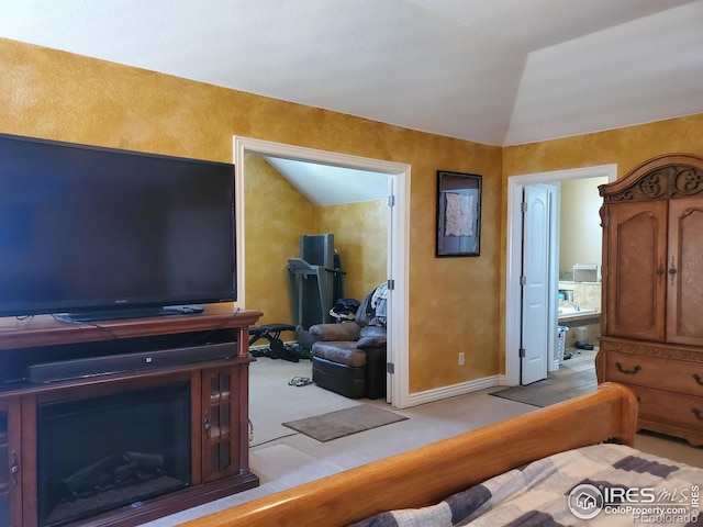 carpeted living room featuring lofted ceiling