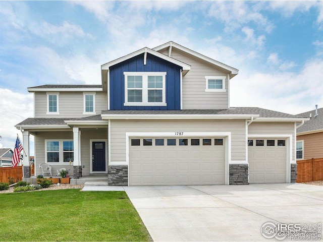 craftsman house featuring a porch, a garage, and a front lawn