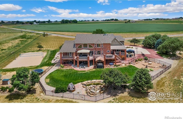 birds eye view of property with a rural view