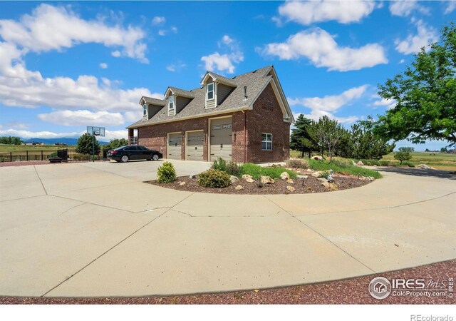 view of side of home featuring a garage