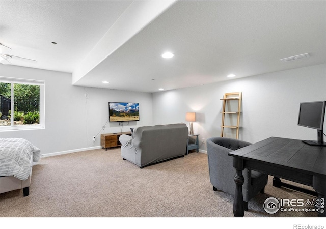 bedroom with ceiling fan and light carpet