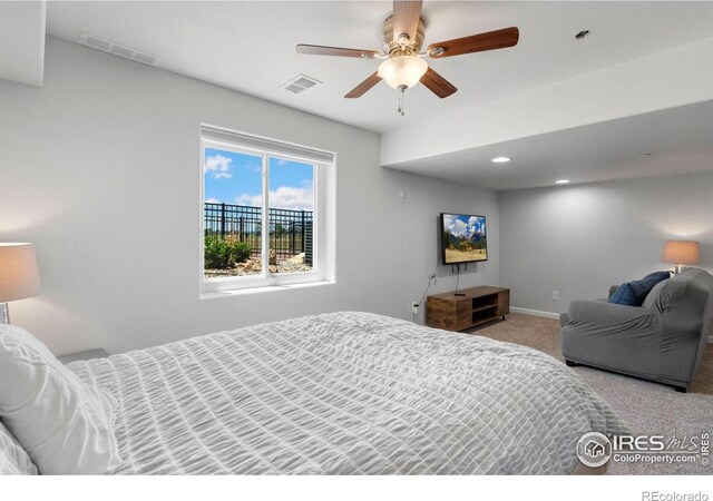 carpeted bedroom with ceiling fan