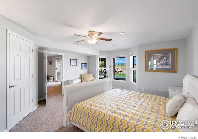 carpeted bedroom with ceiling fan