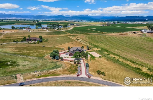 bird's eye view with a rural view and a water and mountain view