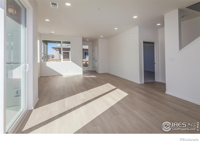 unfurnished room featuring light wood-type flooring