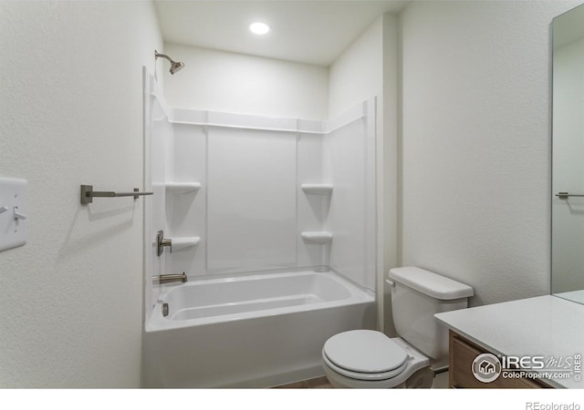 full bathroom featuring vanity,  shower combination, and toilet