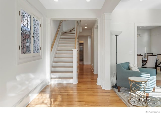 entryway with french doors and wood-type flooring