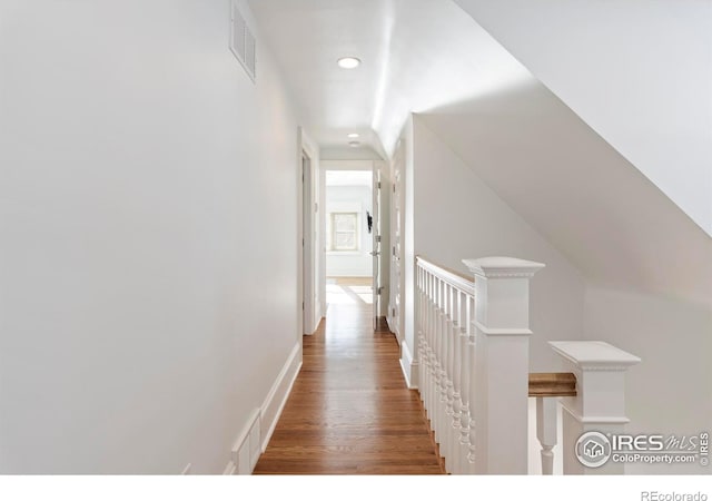 hallway with dark hardwood / wood-style floors