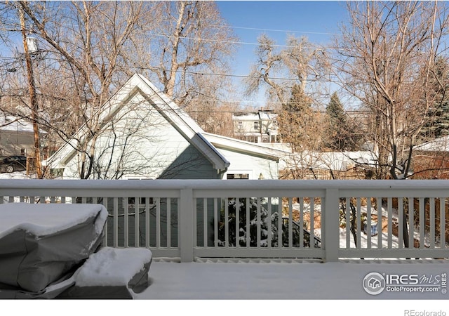 view of snow covered deck