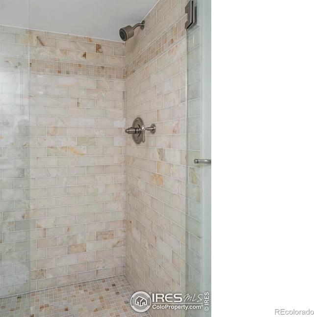 bathroom with a tile shower