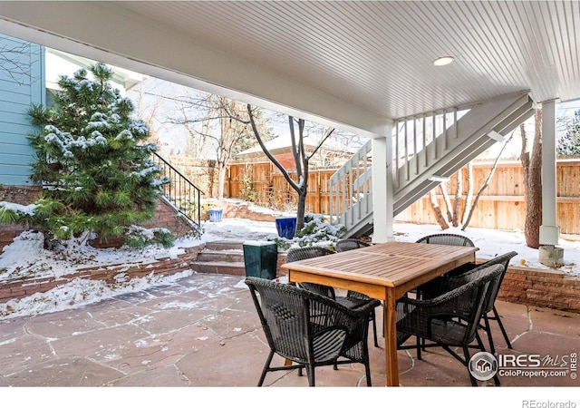 view of snow covered patio