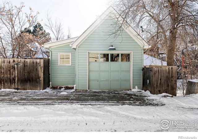 view of snow covered garage