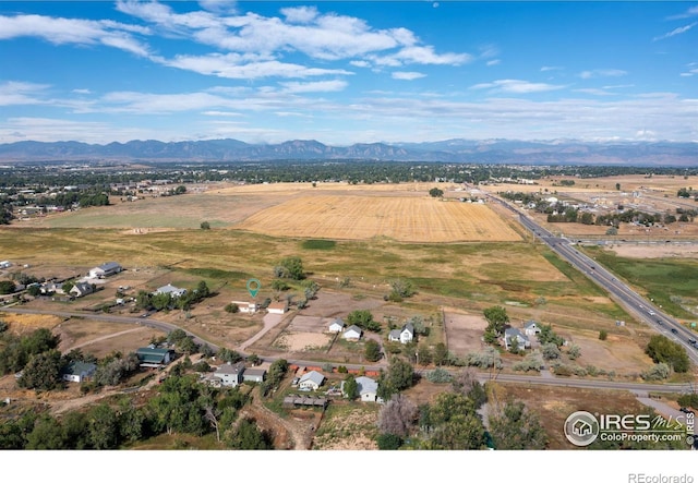 drone / aerial view featuring a mountain view and a rural view