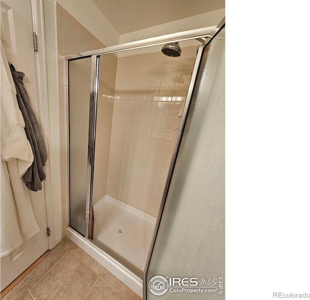 bathroom featuring tile patterned floors and walk in shower