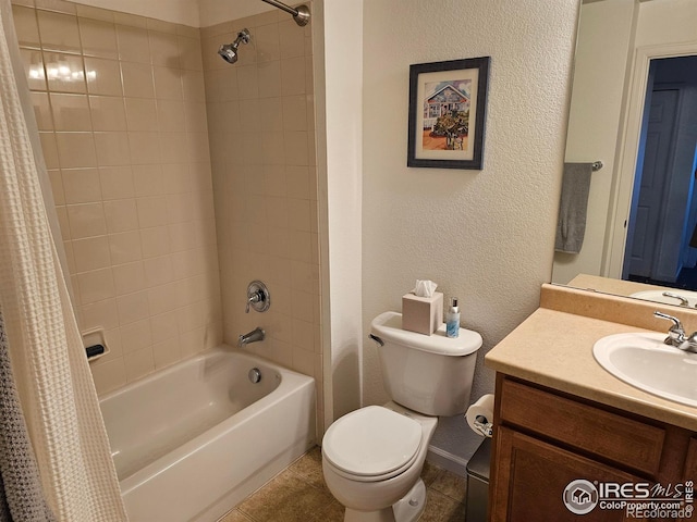 full bathroom featuring tile patterned flooring, shower / bath combination with curtain, vanity, and toilet