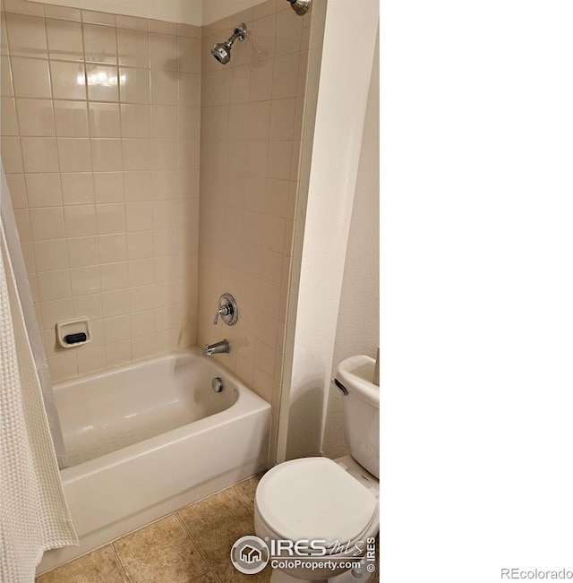 bathroom featuring shower / bath combination with curtain, toilet, and tile patterned floors