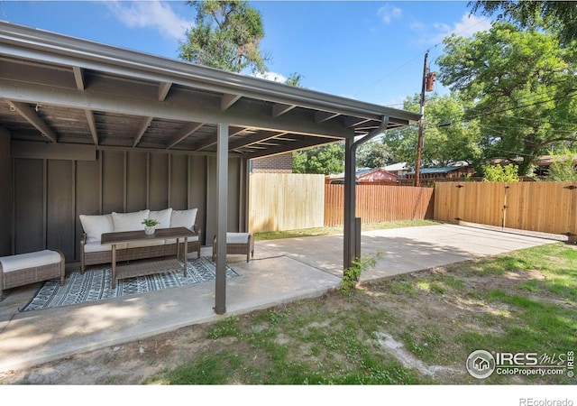 view of patio / terrace featuring outdoor lounge area and fence