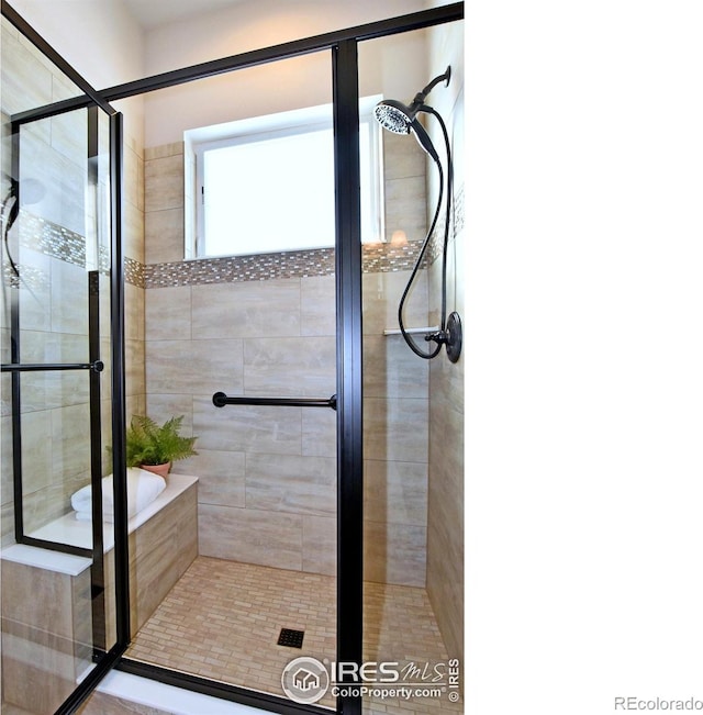 bathroom with separate shower and tub