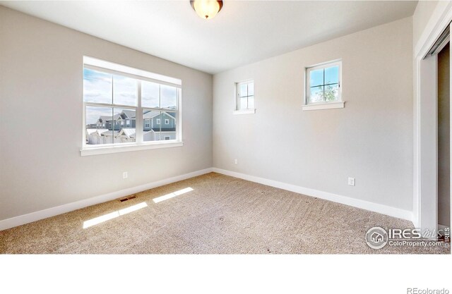 empty room with carpet flooring