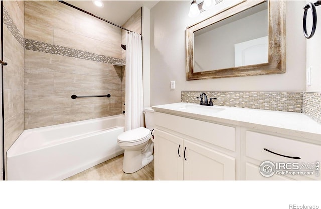 full bathroom with shower / bath combination with curtain, toilet, decorative backsplash, and vanity