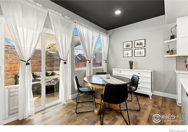 dining space featuring hardwood / wood-style flooring