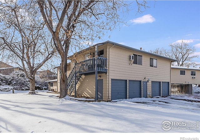 snow covered property featuring a balcony