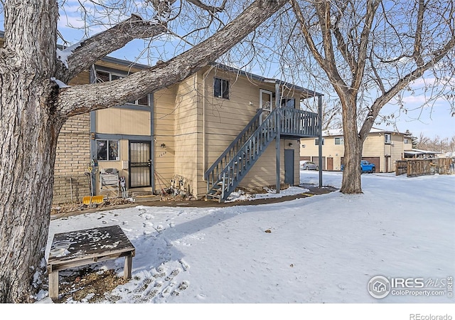 view of snow covered house