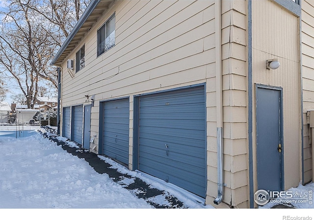 view of snow covered garage