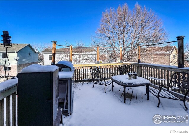 view of snow covered deck