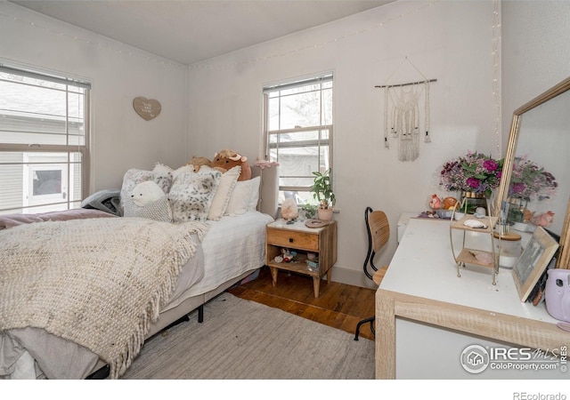 bedroom featuring hardwood / wood-style flooring