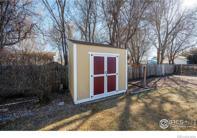 view of outbuilding with a yard