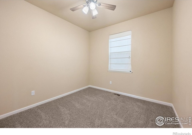 carpeted empty room with ceiling fan