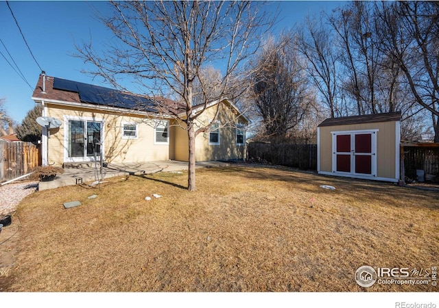 view of yard with a patio and a storage shed