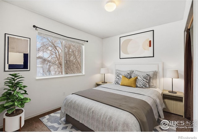 bedroom with dark carpet