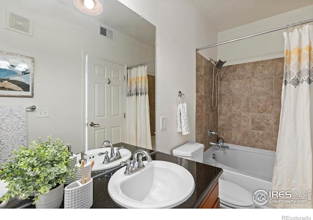 full bathroom featuring vanity, toilet, and shower / bath combo with shower curtain