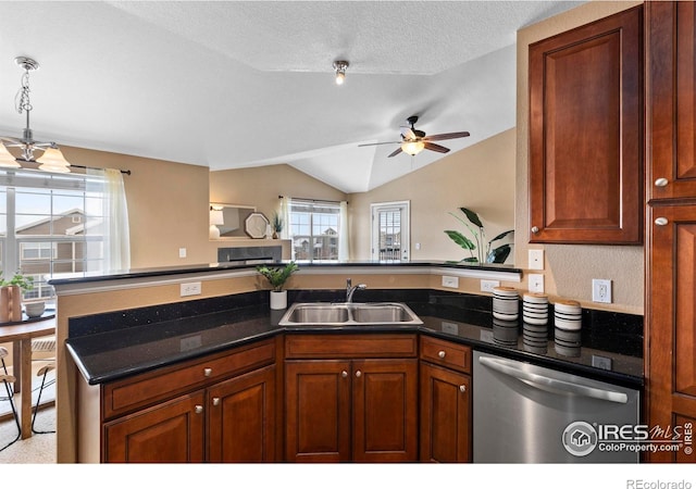 kitchen featuring dishwasher, lofted ceiling, sink, ceiling fan, and a textured ceiling