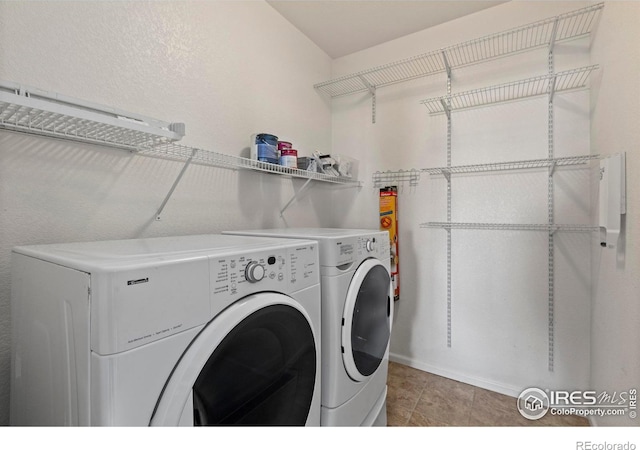 laundry area with washing machine and clothes dryer