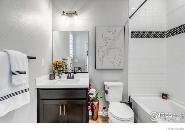 full bathroom with vanity, toilet, and tiled shower / bath combo