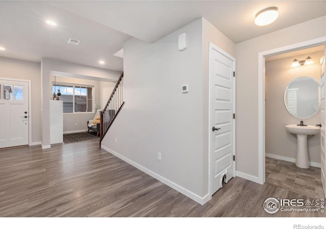 foyer entrance featuring dark hardwood / wood-style floors