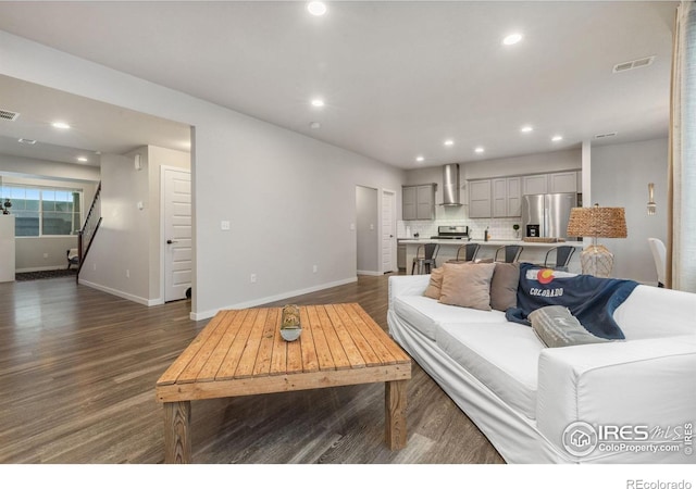 living room featuring dark hardwood / wood-style flooring