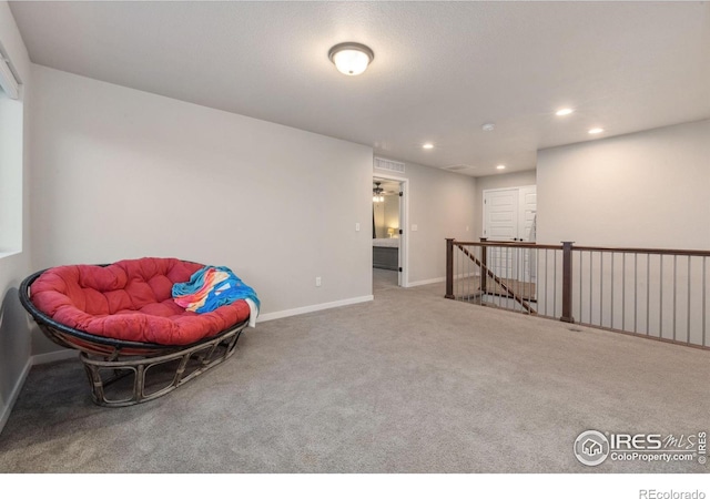 sitting room with carpet flooring