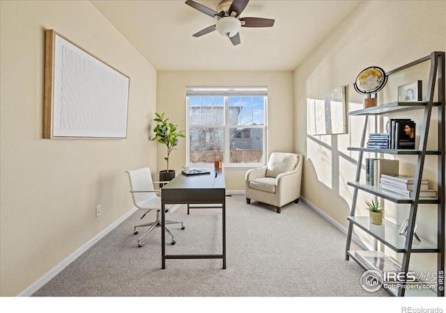 home office with light carpet and ceiling fan