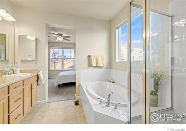 bathroom featuring vanity, plenty of natural light, independent shower and bath, and ceiling fan