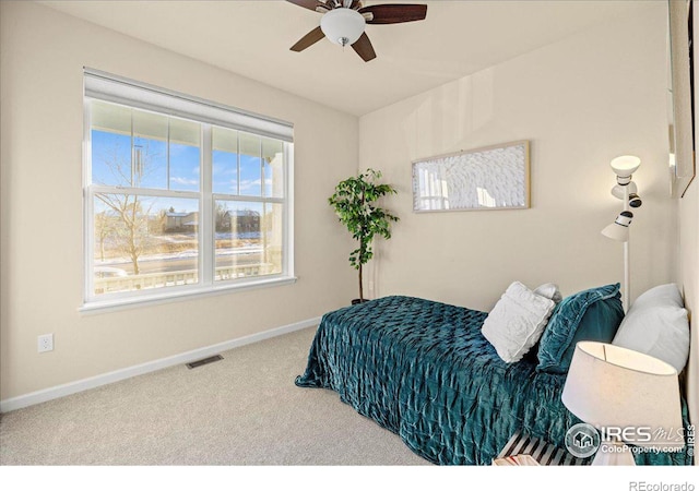 bedroom with ceiling fan and carpet floors