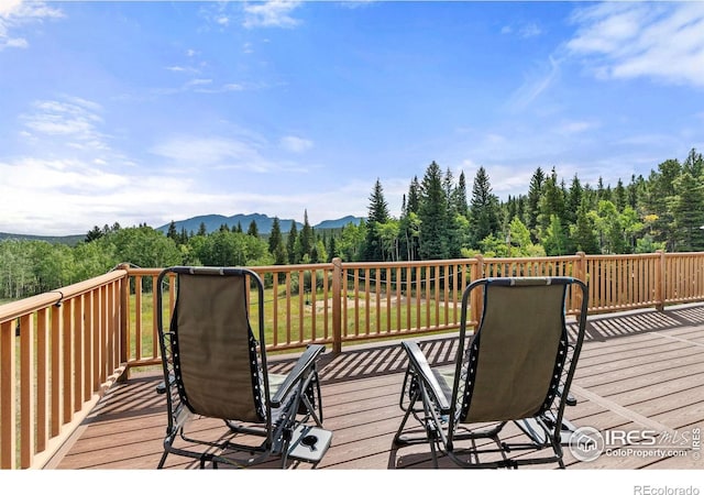 wooden terrace with a mountain view