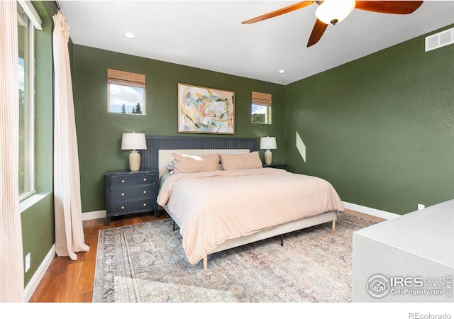 bedroom featuring wood-type flooring and ceiling fan